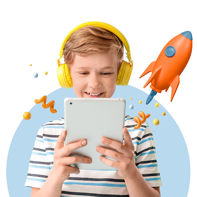 a smiling kid looking at his tablet