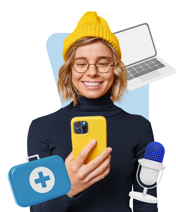 Smiling woman with cap and mobile in hand. Microphone, first aid kit, and laptop around her