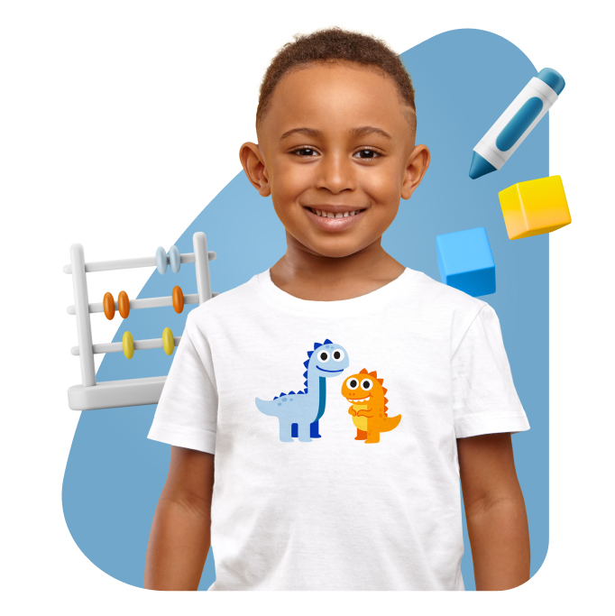 Little boy with dinosaurs on his T-shirt surrounded by school objects