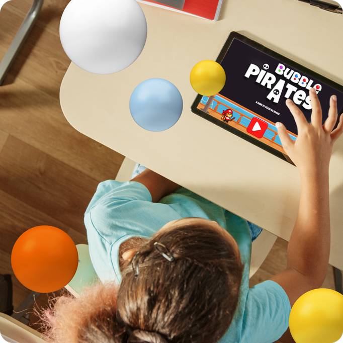 A student playing Bubble Pirates on a tablet