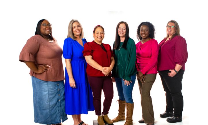Six female teachers standing